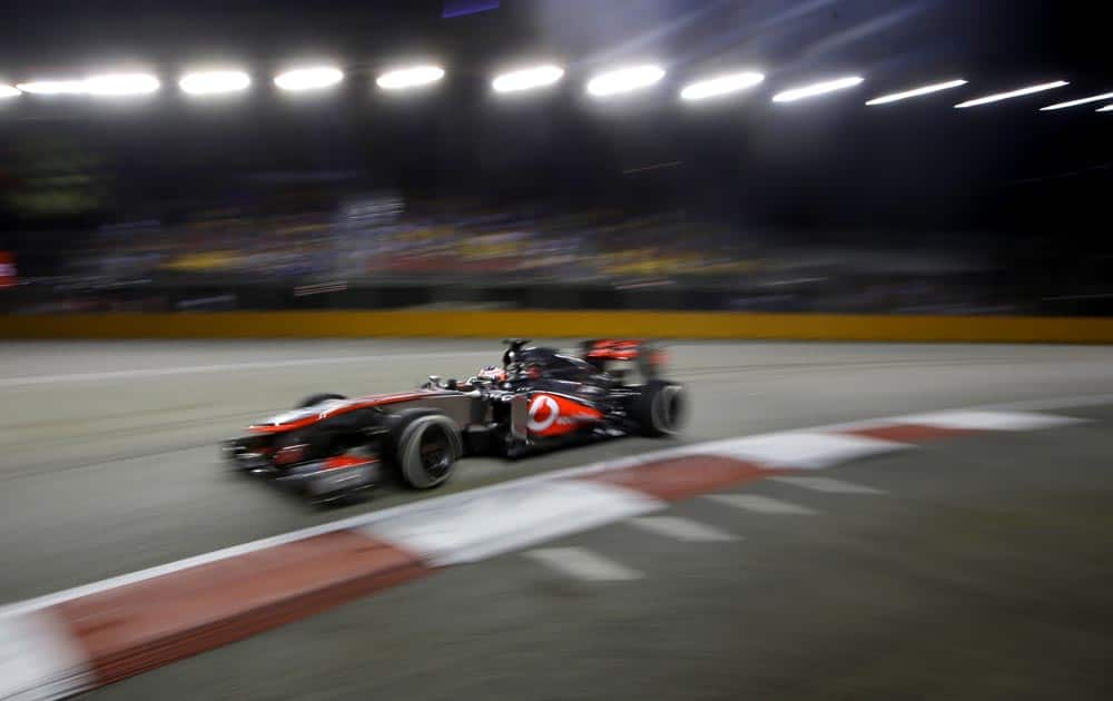 McLaren Mercedes driver Jenson Button of Britain steers his car during the second practice session at the Singapore.