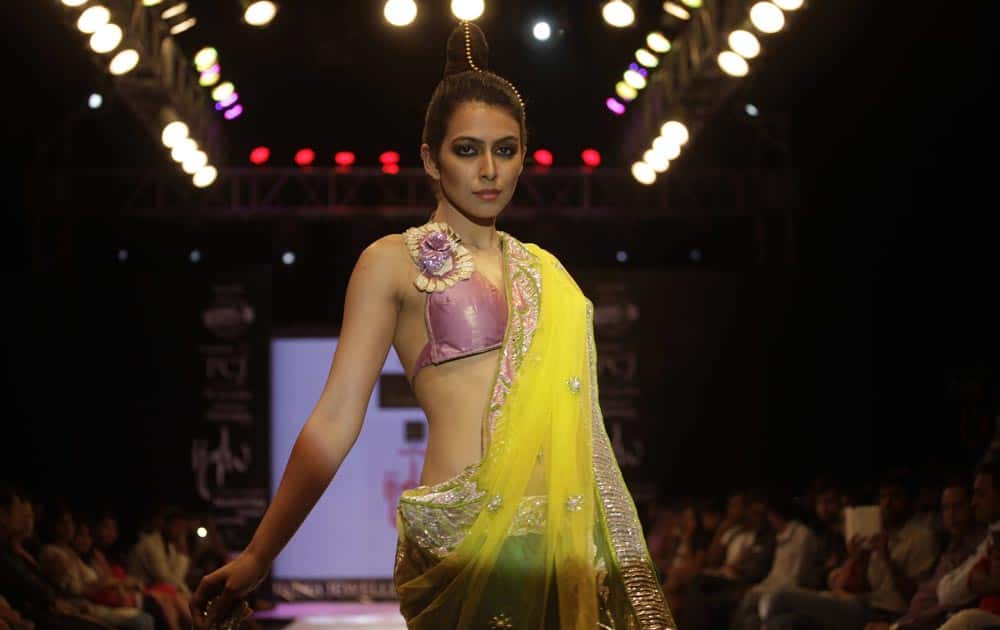 A model displays a creation by designer Mohit Falod during the India Jewellery and Fashion Week in Ahmedabad.