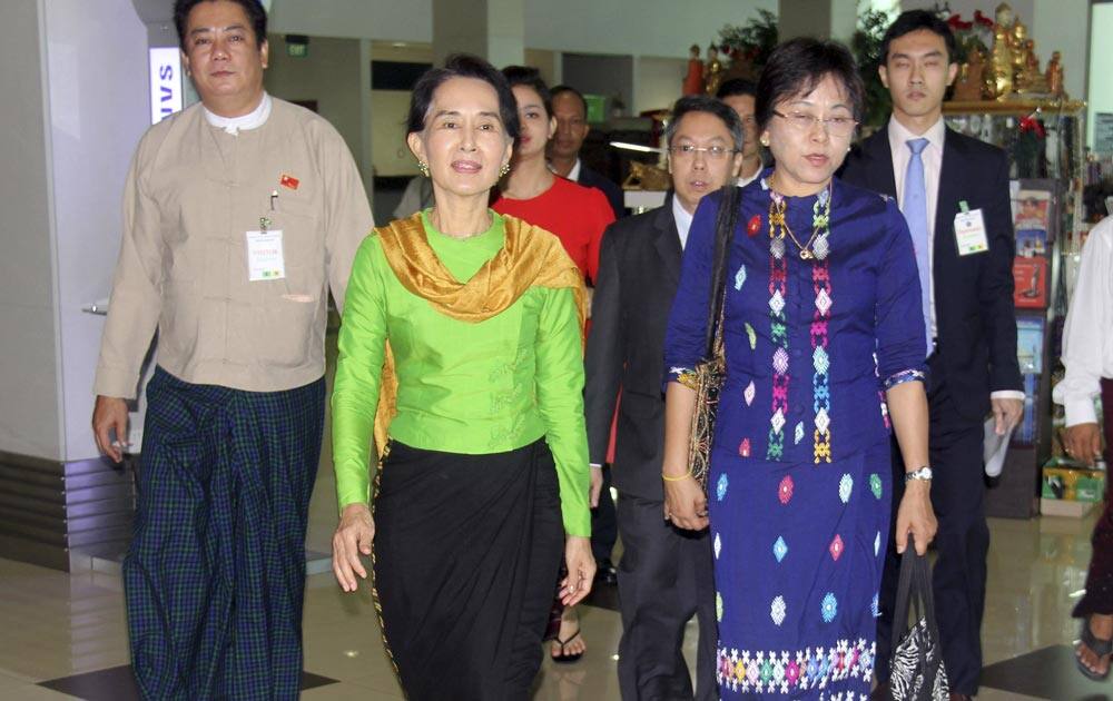 Myanmar Opposition leader Aung San Suu Kyi, leaves for Singapore at Yangon International Airport in Yangon, Myanmar.
