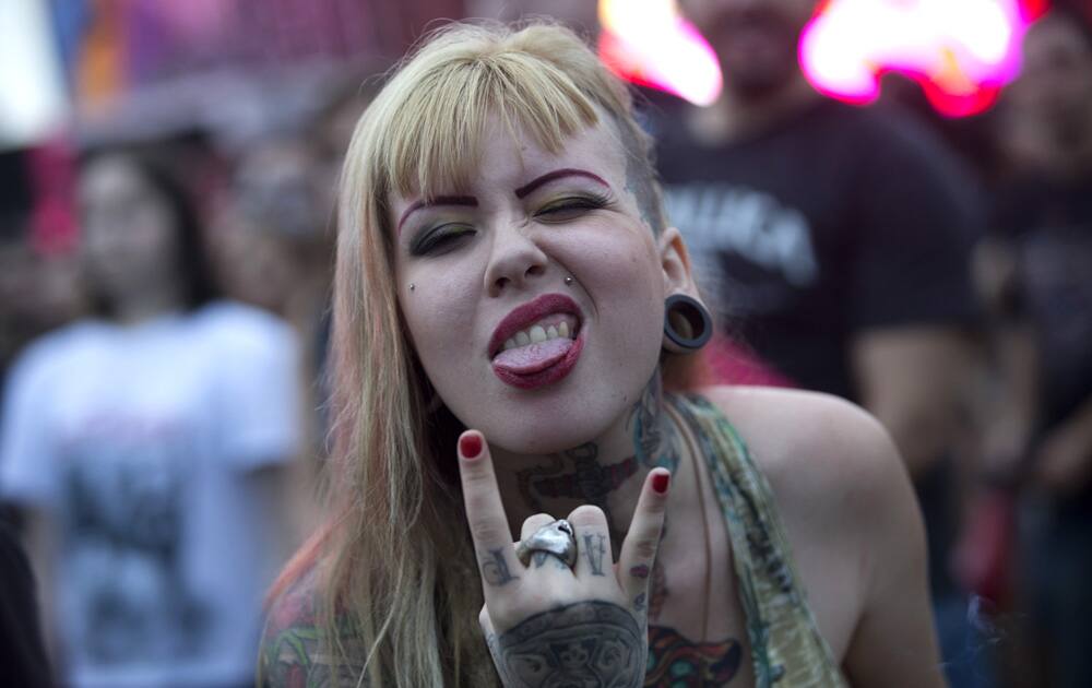 A music fan flashes the Devil`s Horns or metal hand sign during the Rock in Rio music festival, in Rio de Janeiro, Brazil.