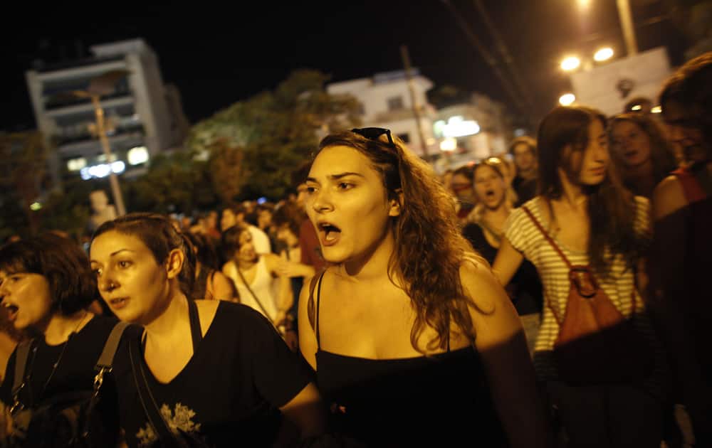 A protester shouts slogans during a demonstration after the stabbing of Pavlos Fyssas who died early Wednesday, in the suburb of Nikaia near Athens.