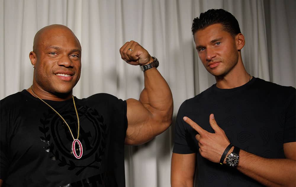 Director Vlad Yudin, right, and 2012 Mr. Olympia Phil Heath pose for a portrait in Los Angeles.