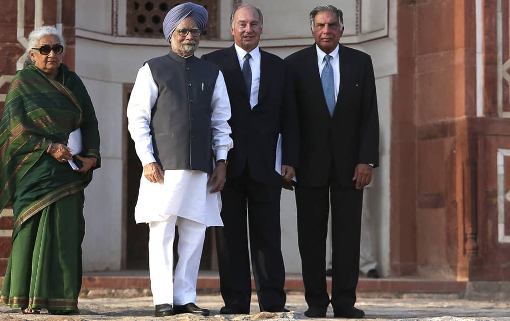 Prime Minister Manmohan Singh stands with the Aga Khan, spiritual head of Ismaili Muslims, Chairman of Sir Dorabji Tata Trust Ratan Tata and Indian Minister for Culture Chandresh Kumari Katoch after the inauguration of the restored 16th century Humayun`s Tomb in New Delhi.