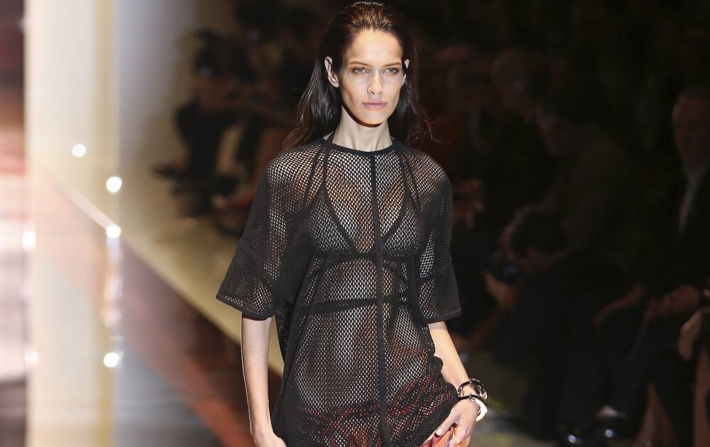 A model wears a creation for Gucci women`s Spring-Summer 2014 collection, part of the Milan Fashion Week, unveiled in Milan, Italy.