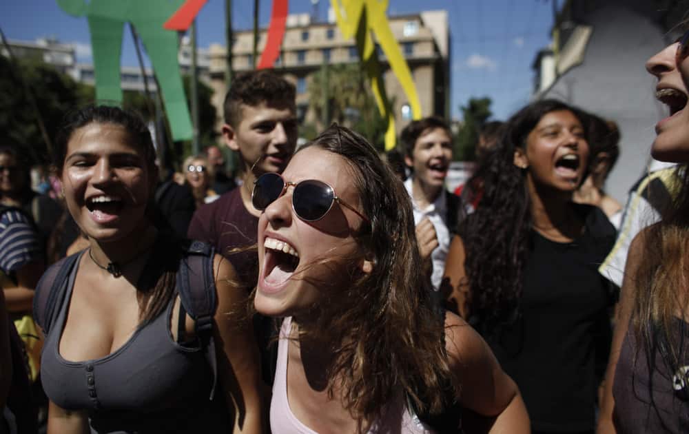 High school students shout slogans in solidarity with their striking teachers during a 48 hour general strike in Athens.