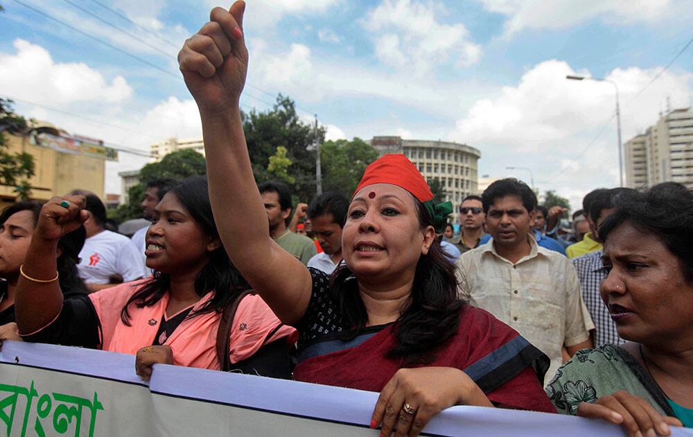 Bangladeshi social activists shout slogans during a rally against a strike called by Bangladesh`s largest Islamic party, Jamaat-e-Islami, in Dhaka.