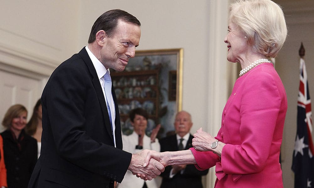 Tony Abbott, left, shakes hands with Governor General Quentin Bryce after being sworn in as the 28th prime minister of Australia at Government House in Canberra.