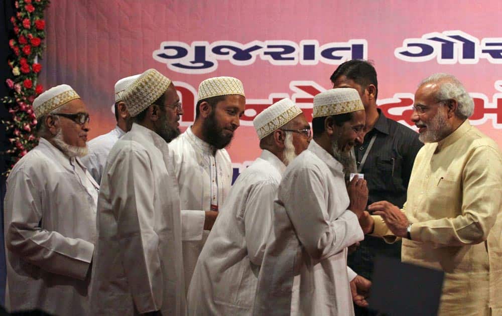 Muslims greet Gujarat state Chief Minister Narendra Modi, during a function to celebrate his birthday in Gandhinagar.