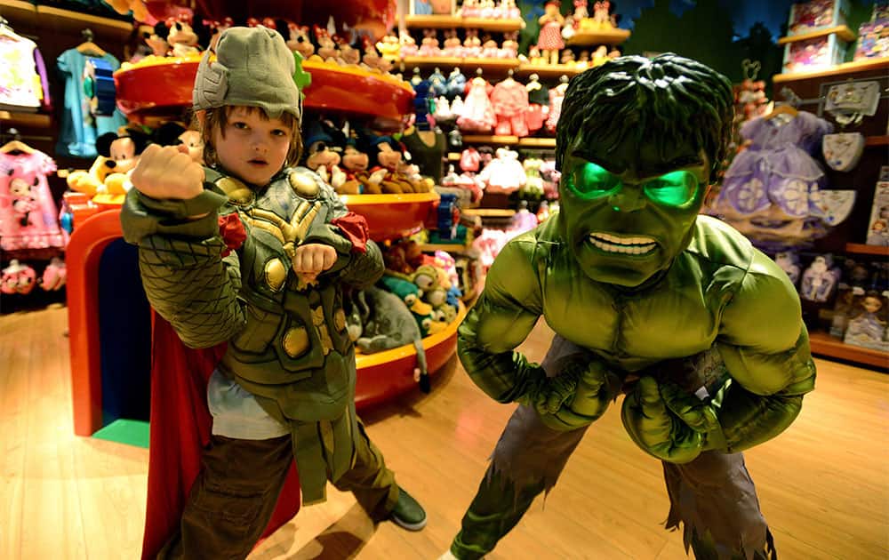 Jackson Oliver Fox, on the left, age 8, dressed as Thor, and James Nenninger, dressed as Hulk, pose at Disney Store’s Halloween BOOtique Party in Glendale, CA.