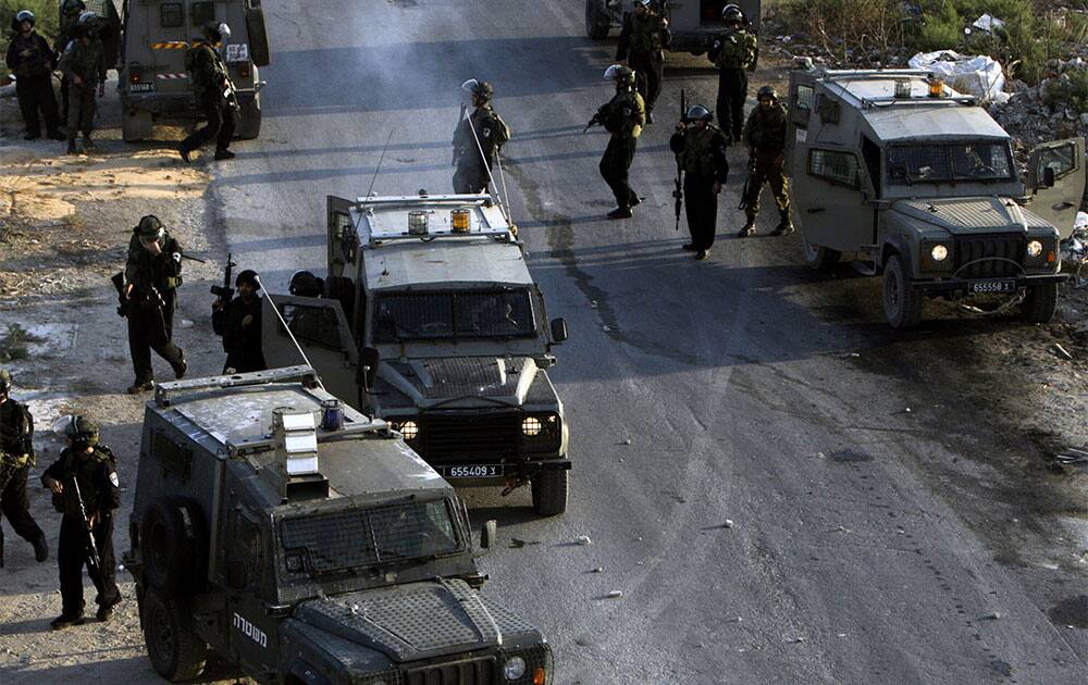Israeli soldiers gather during an operation in the Jenin refugee camp, near the West Bank city of Jenin.