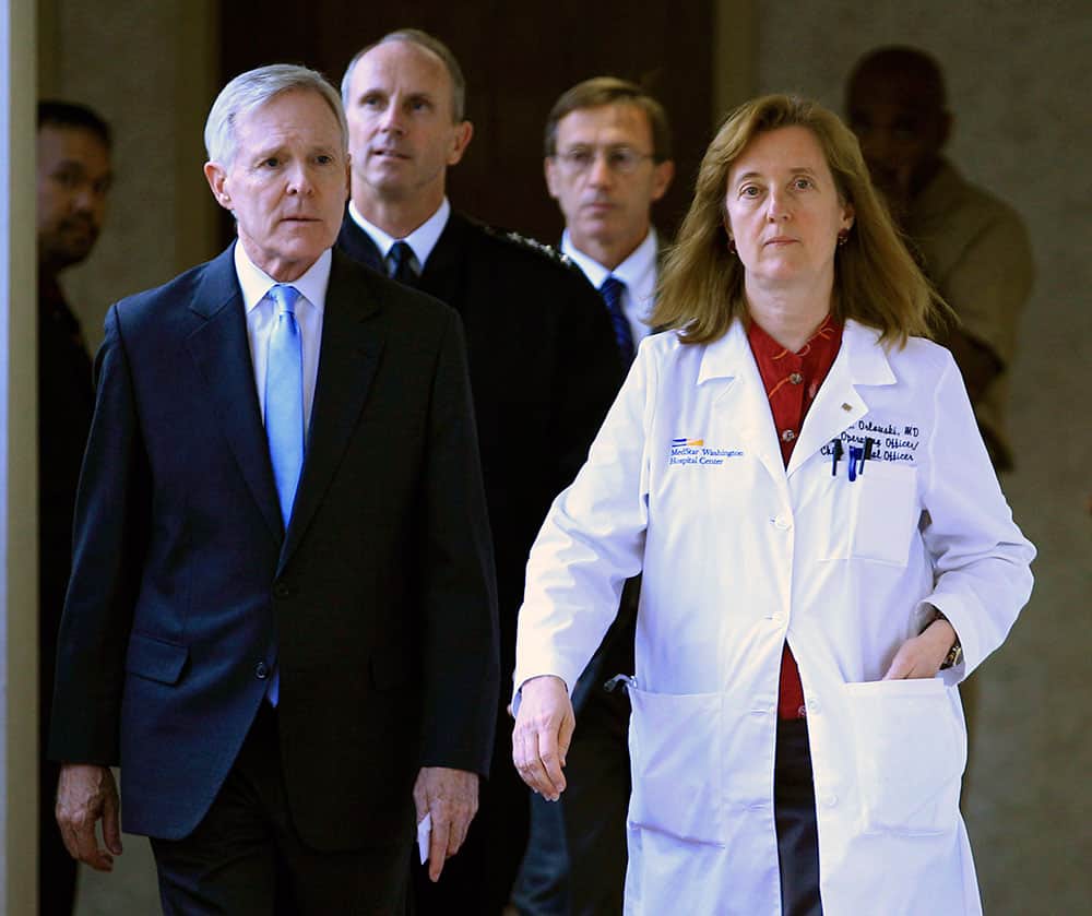 Secretary of the Navy Ray Mabus and Washington Hospital Center chief operating officer Janis M. Orlowski walk to a news conference in Washington, after visiting the people injured in the shooting at Washington Navy Yard.