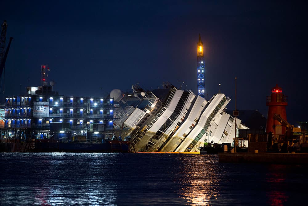 The Costa Concordia ship lies on its side on the Tuscan Island of Giglio, Italy. In an unprecedented maritime salvage operation, engineers on Monday gingerly wrestled the hull of the shipwrecked Costa Concordia off the Italian reef where the cruise ship has been stuck since January 2012.