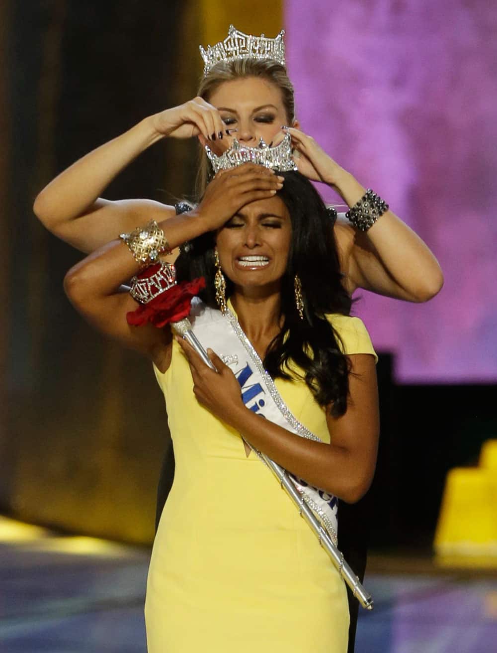Miss New York Nina Davuluri, front, is crowned as Miss America 2014 by Miss America 2013 Mallory Hagan in Atlantic City, N.J.