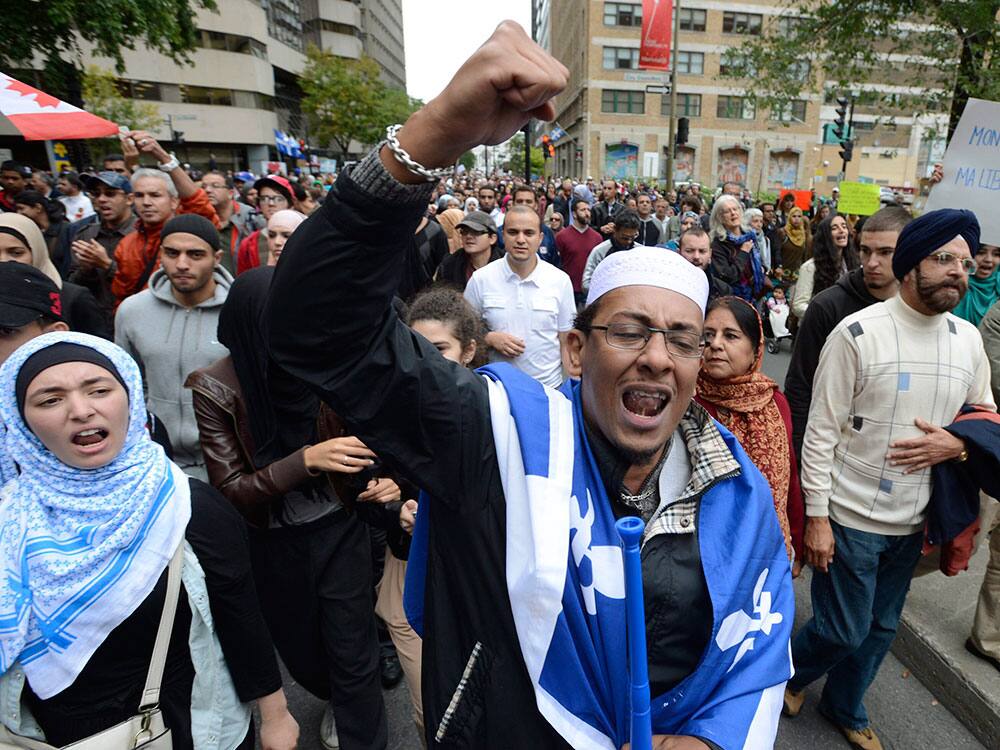 Demonstrators take part in a protest against Quebec`s proposed