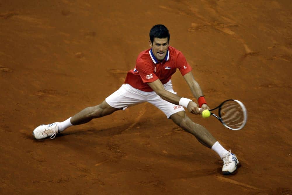 Serbia`s Novak Djokovic returns the ball to Canada`s Milos Raonic during their Davis Cup semifinals tennis match in Belgrade, Serbia.