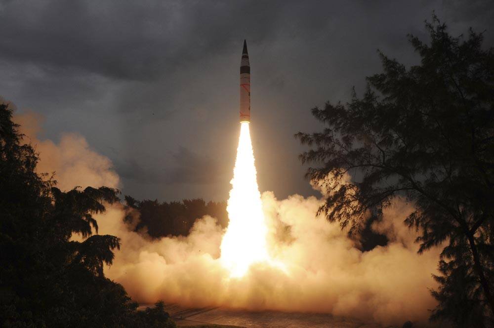 This photo released by India`s Defence Research and Development Organisation (DRDO), India’s nuclear-capable missile Agni-V is test fired in Wheelar’s Island, off the coast of Odisha.