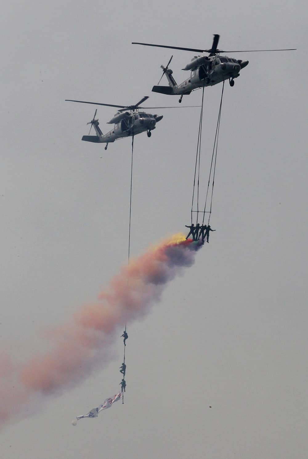 South Korean Special Forces soldiers hang from helicopters during the 63rd Incheon Landing Operations Commemoration ceremony in waters off Incheon, South Korea.