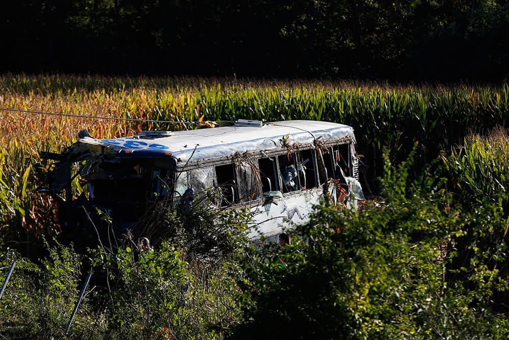 A crew works to remove an overturned Greyhound bus from a field following a crash along interstate 75 in Liberty Township, Ohio. At least 35 people were injured in the accident.