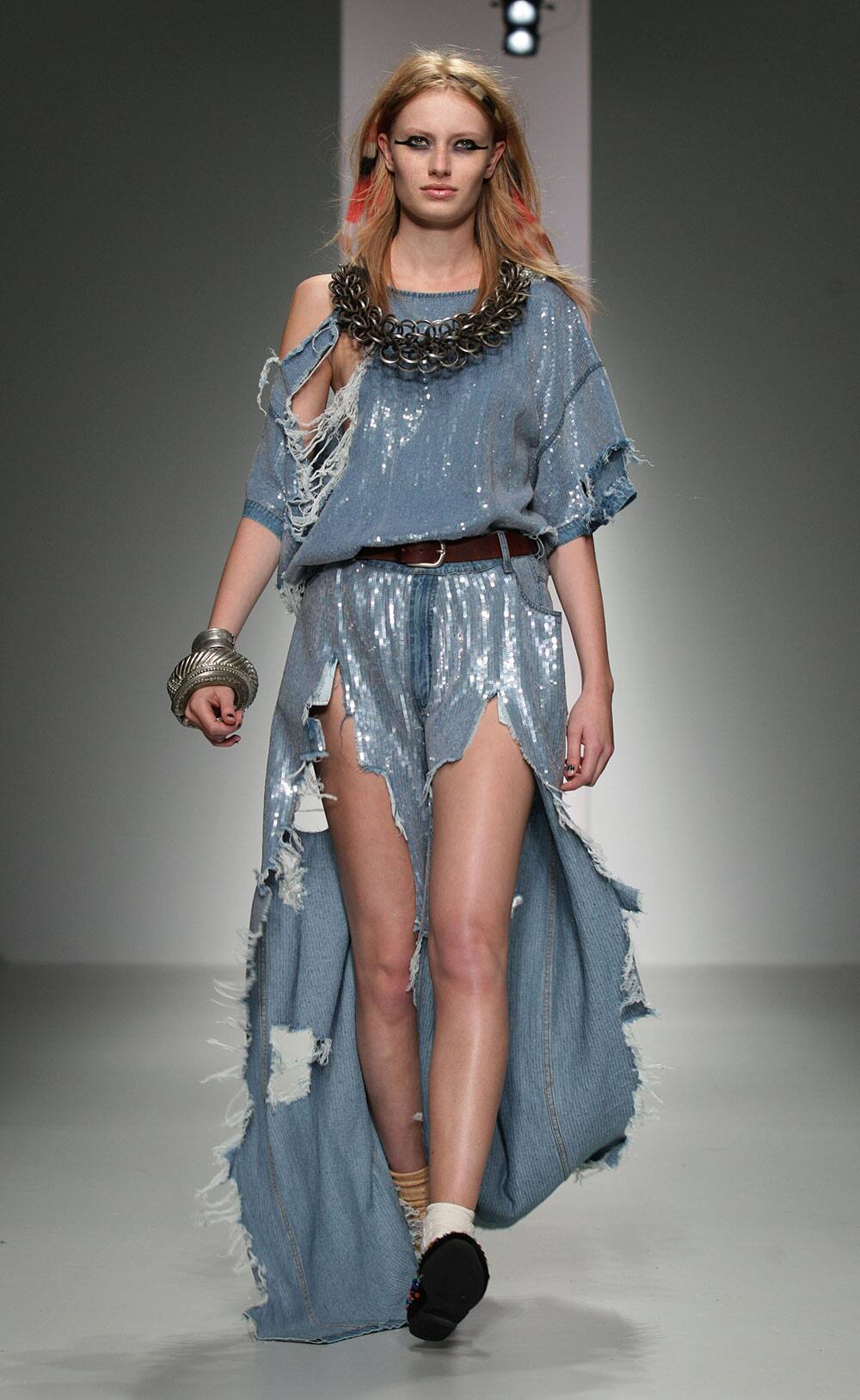 A model wears a creation by Ashish during London Fashion Week Spring/Summer 2014, in central London.