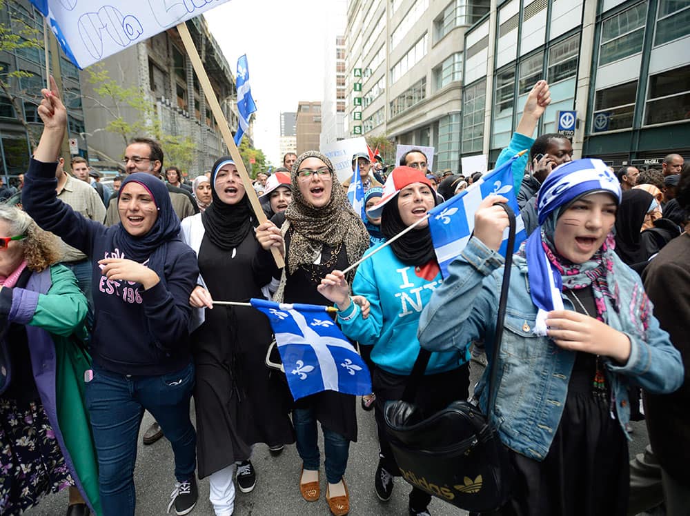 Demonstrators take part in a protest against Quebec`s proposed