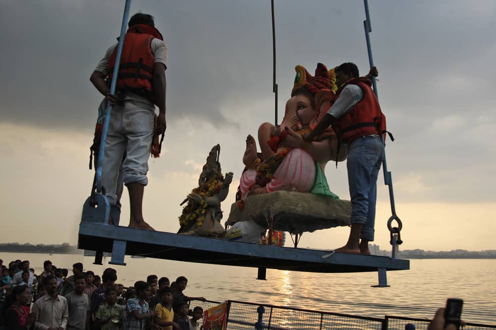 An idol of Hindu god Ganesha is lifted to be immersed in the Hussain Sagar Lake during Ganesh Chaturthi festival celebrations in Hyderabad.