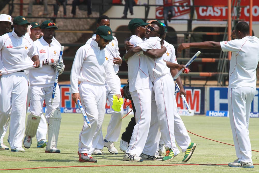 Zimbabwean players celebrate after beating Pakistan by 24 runs on the last day of the last test match of the series at the Harare Sports Club in Harare.