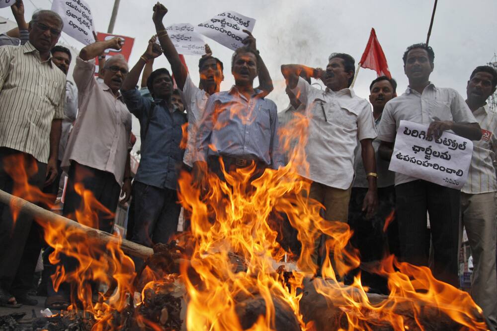 Activists of Communist Party of India (Marxist) burn an effigy representing India`s ruling United Progressive Alliance government in Hyderabad. The activists were protesting hike in fuel prices.