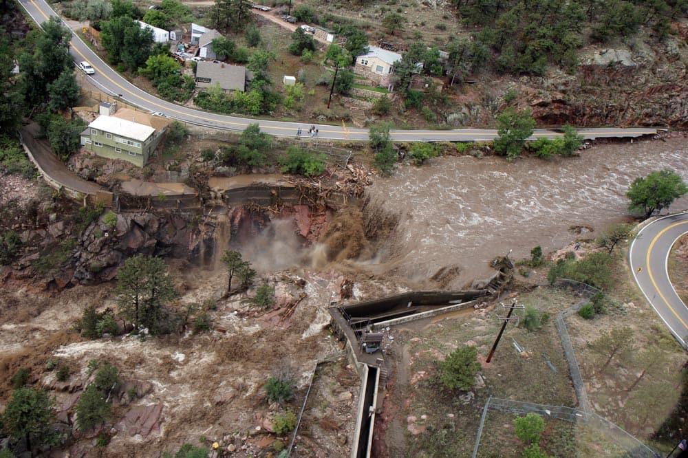 This aerial photo shows a raging waterfall destroying a bridge along Highway 34 toward Estes Park, Colo. as flooding continues to devastate the Front Range and thousands are forced to evacuate with an unconfirmed number of structures destroyed.
