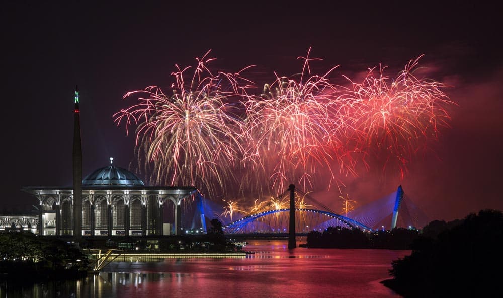 Team France presents fireworks over Malaysia`s landmark Putrajaya Millennium Monument, Tuanku Mizan Zainal Abidin Mosque, left, and Seri Saujana Bridge during the Putrajaya International Fireworks Competition at the administrative capital of Putrajaya outside Kuala Lumpur.