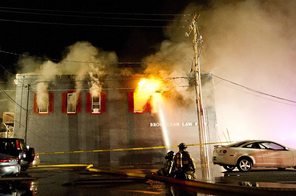 Firefighters contained the large blaze that burned several buildings housing businesses, apartments and a mosque, Fire Chief Curt Bittle said.