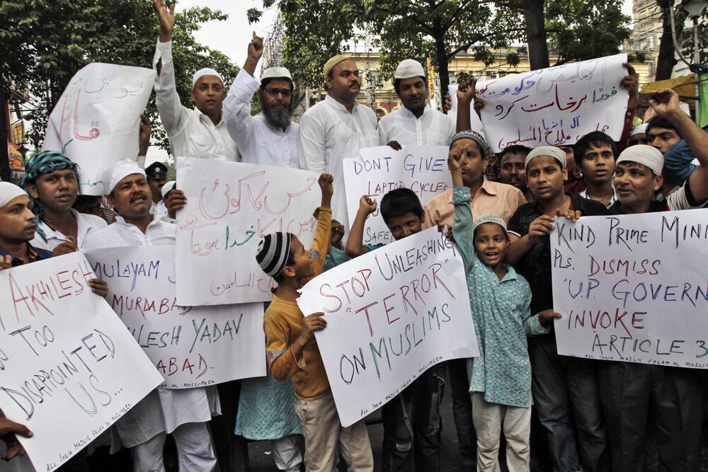 Muslims block a road as they shout slogans during a protest against the recent communal violence in the town of Muzaffarnagar in Uttar Pradesh.