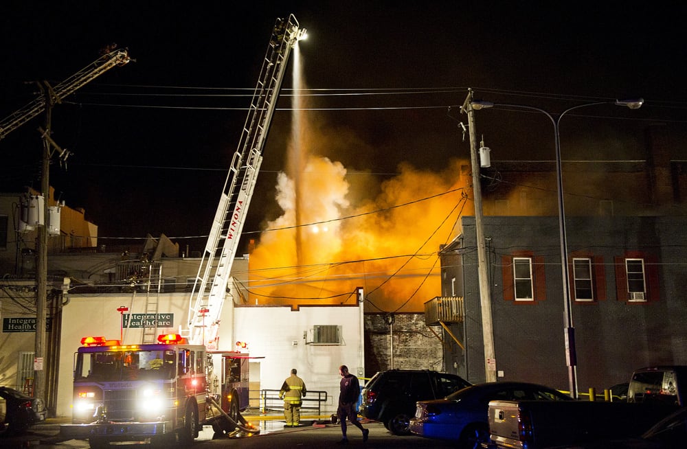 Firefighters battle a blaze in several downtown buildings in Winona, Minn. Winona Fire Chief Curt Bittle says the Islamic Center caught fire early Friday morning and the blaze quickly spread to other buildings.