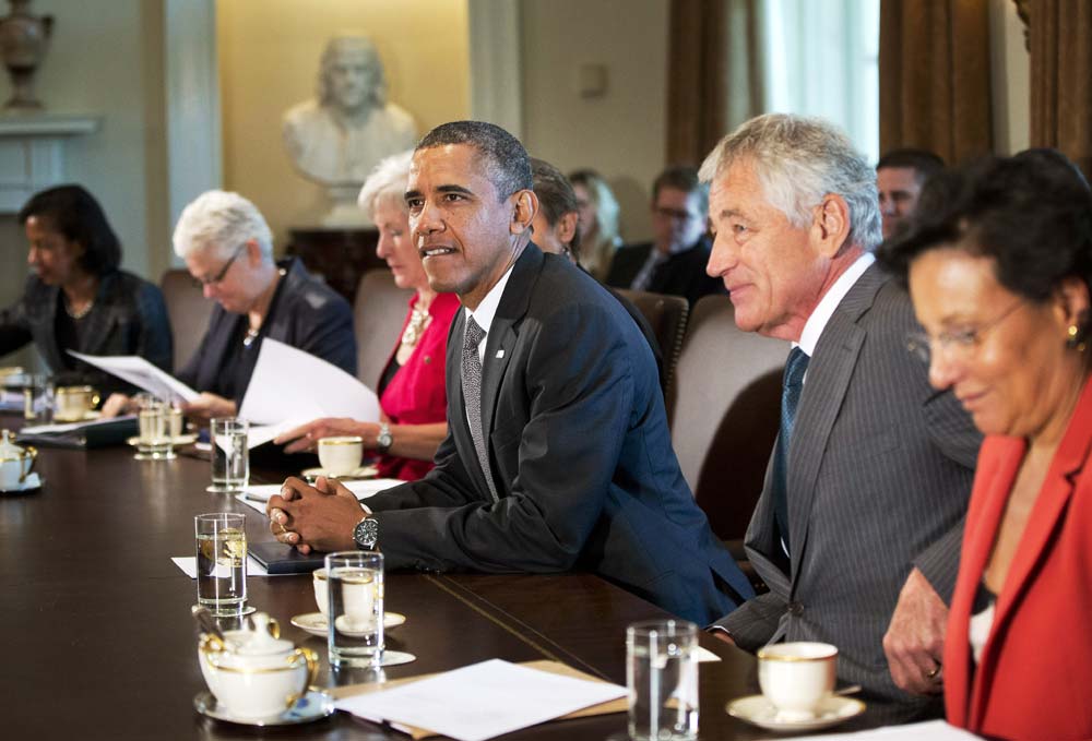 President Barack Obama awaits the start of a meeting with members of his cabinet, in the Cabinet Room of the White House in Washington.