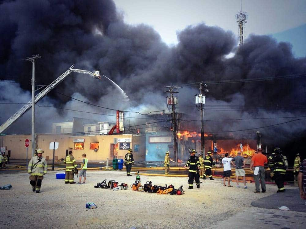 Firefighters battle a raging fire on the boardwalk in Seaside Heights, N.J. that apparently started in an ice cream shop and has spread several blocks to neighboring Seaside Heights.