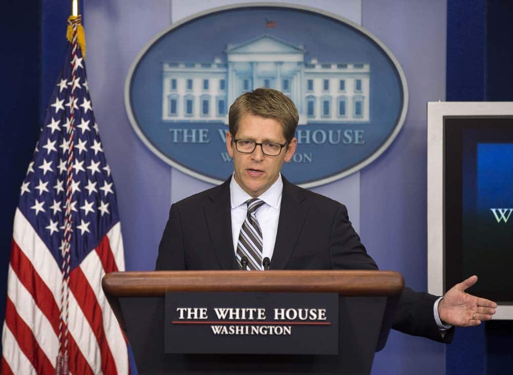 White House press secretary Jay Carney gestures as he answers questions on Syria during the daily news briefing, at the White House in Washington.