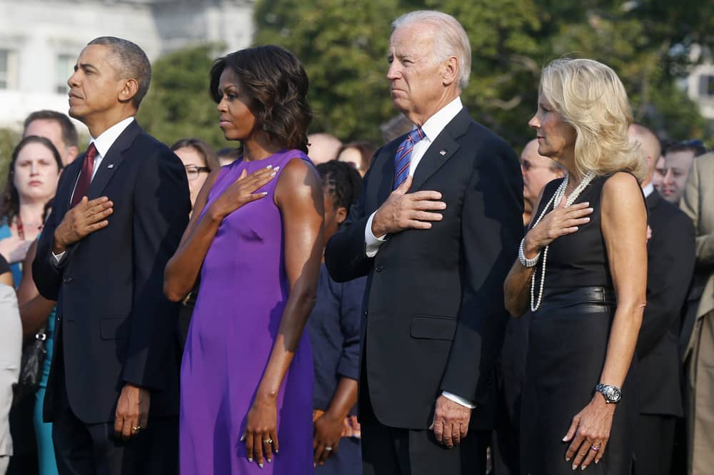 President Barack Obama, first lady Michelle Obama, Vice President Joe Biden, and Jill Biden put their hands to their hearts during the playing of