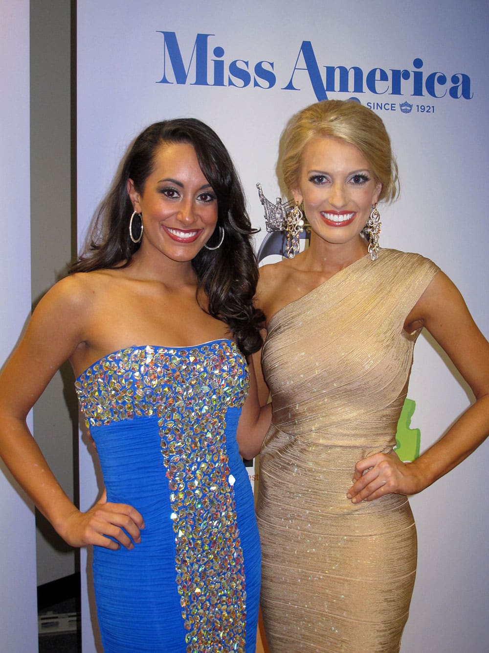 Miss New Hampshire Samantha Russo, left, and Miss Mississippi Chelsea Rick pose for photographers after winning the first night of preliminary competition in the Miss America pageant in Atlantic City, N.J.