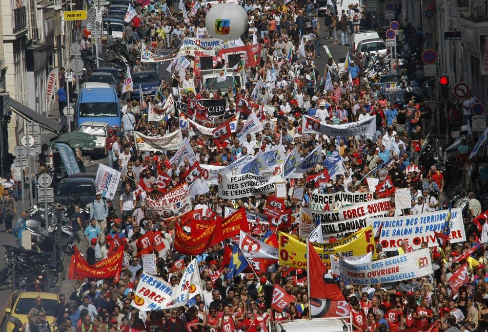 Workers of the private sector and public services demonstrate through the streets of Marseille, southern France.