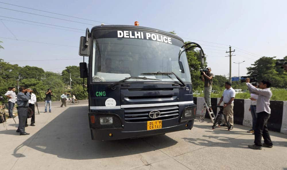 A police van arrives at the premises of a court carrying four men accused in the fatal gang rape of a young woman on a moving New Delhi bus last year, in New Delhi.