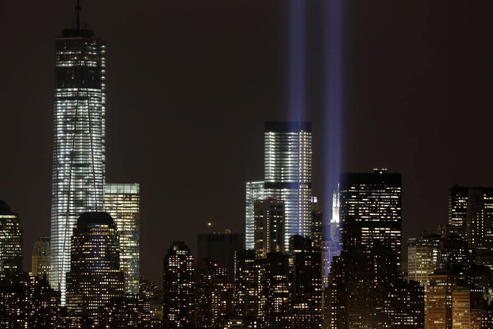 The Tribute in Light rises above the lower Manhattan skyline and Four World Trade Center and One World Trade Center, in a test of the memorial light display, in New York.