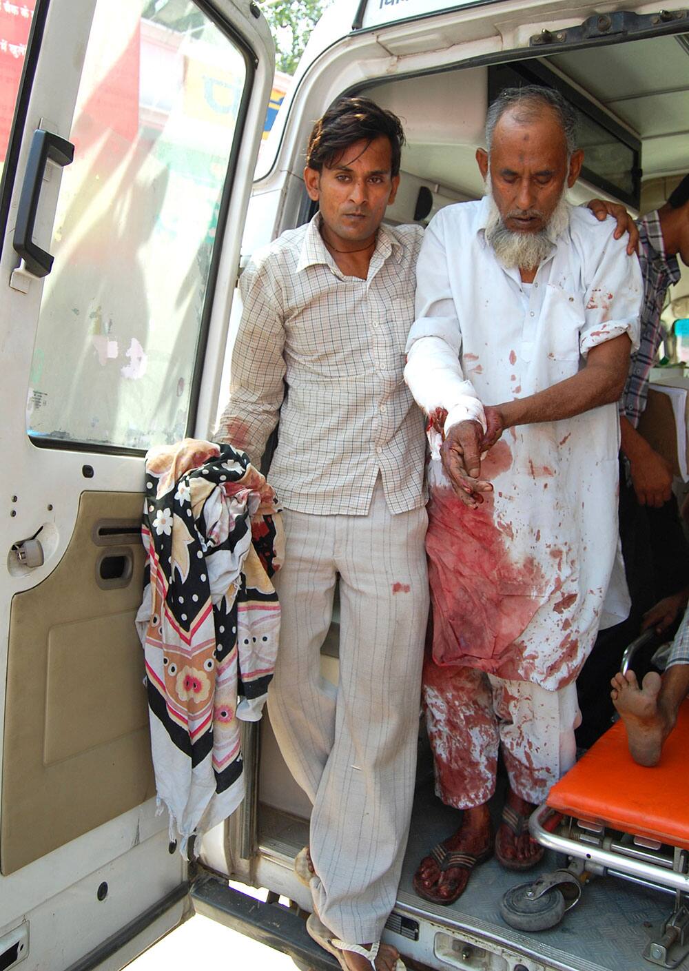 A man who was injured in communal clashes is brought for treatment at the district hospital in Muzaffarnagar.