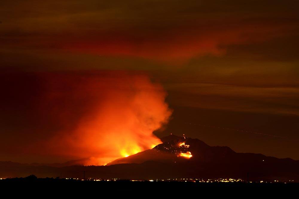 A wildfire burns out of control on the slopes of Mount Diablo in Contra Costa County, Calif., seen from the Woodbridge Ecological Reserve located in the Sacramento–San Joaquin River Delta.