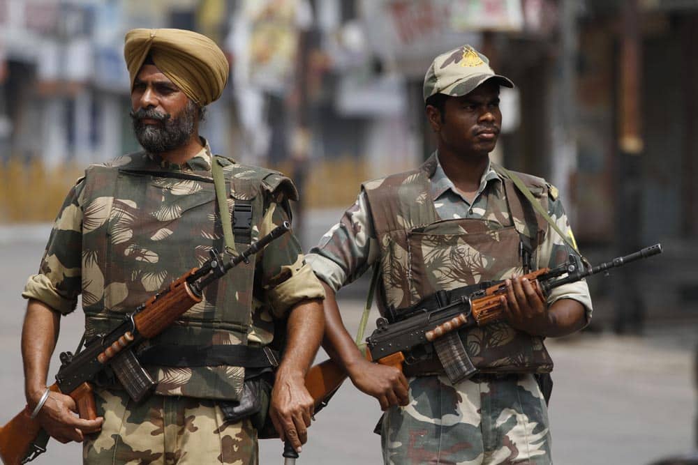 Paramilitary soldiers patrol a street during a curfew imposed following communal clashes in Muzaffarnagar, about 125 kilometers (78 miles) north of New Delhi.