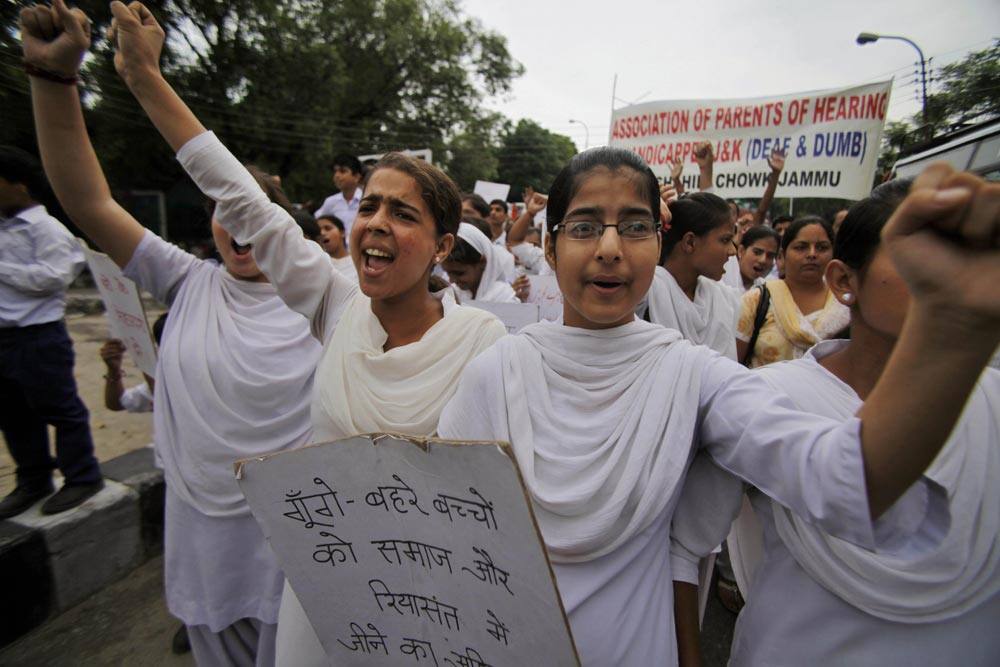 Hearing impaired students shout slogans during a protest against the Sept. 4 rape of a mentally disabled girl staying at a home run by a non-governmental organization in Jammu.
