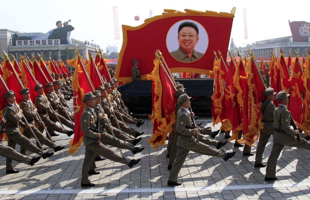 North Korean troops march past a portrait of the late leader Kim Jong Il during a military parade at Kim Il Sung Square to mark the 65th anniversary of the country`s founding in Pyongyang.