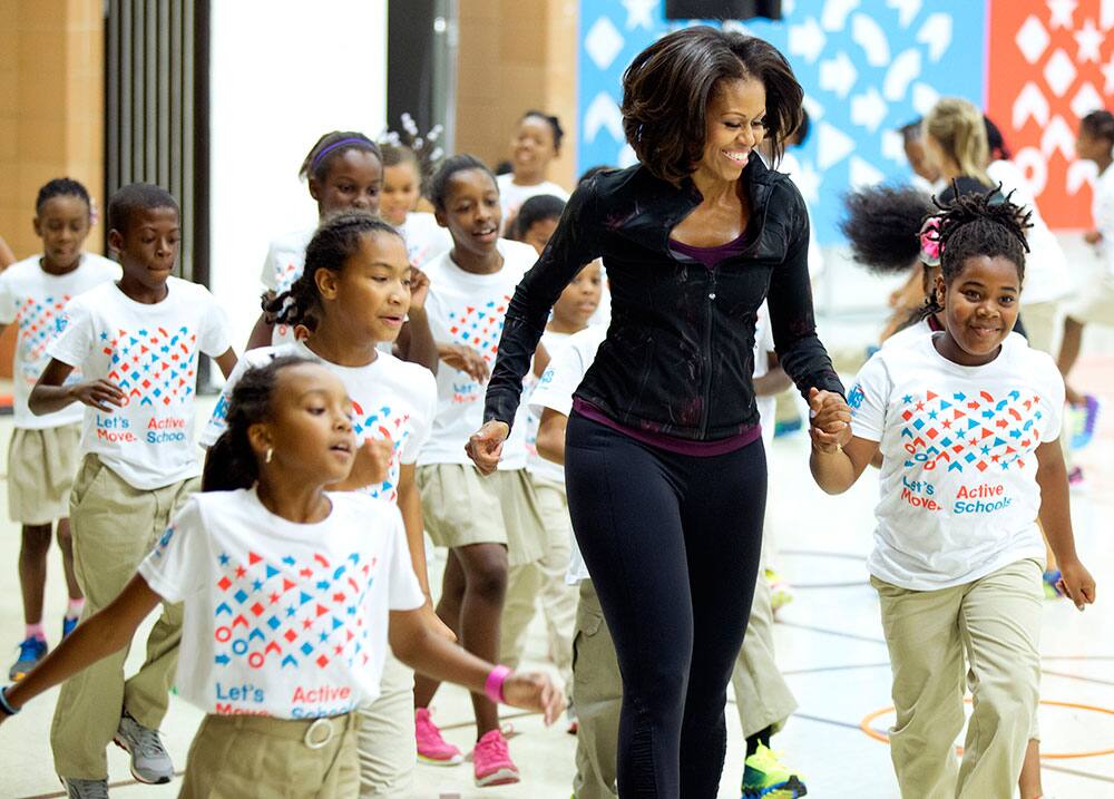First lady Michelle Obama joins exercises with pupils at Orr Elementary in Washington, during a visit for a back to school event highlighting healthy changes happening in schools and across the country.