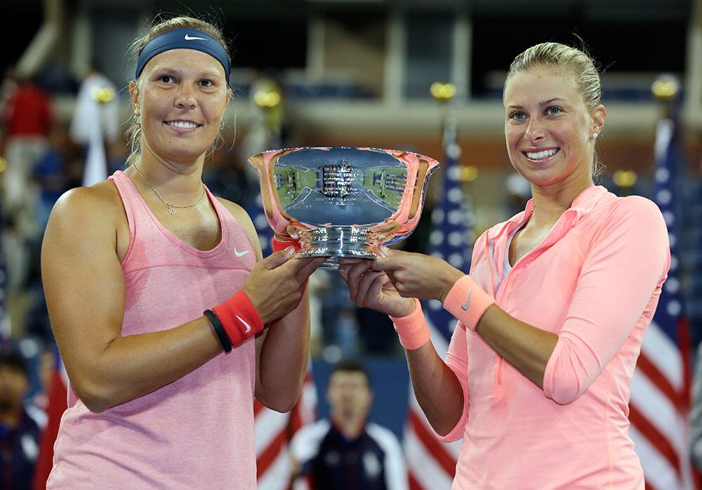 Lucie Hradecka, left, and Andrea Hlavackova, of the Czech Republic, hold the championship trophy after defeating Ashleigh Barty and Casey Dellacqua of Australia in the women`s doubles final of the 2013 US Open tennis tournament.