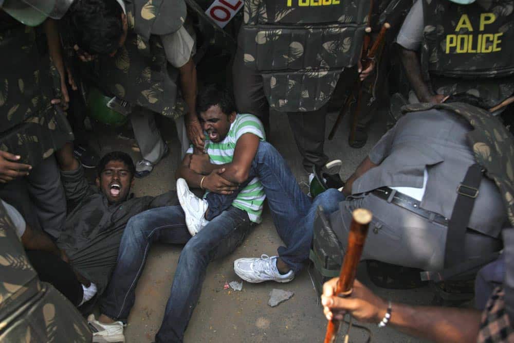 Policemen detain supporters of creation of a separate state of Telangana from the current southern Indian state of Andhra Pradesh, during a demonstration in Hyderabad.