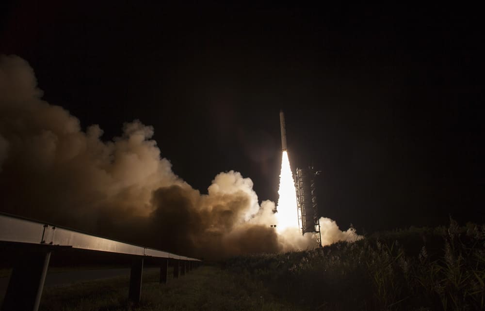This photo provided by NASA, an unmanned Minotaur rocket carries NASA`s newest robotic explorer, the LADEE spacecraft, which is charged with studying the lunar atmosphere and dust, after launching to the moon from NASA`s Wallops Flight Facility on Virginia`s Eastern Shore.