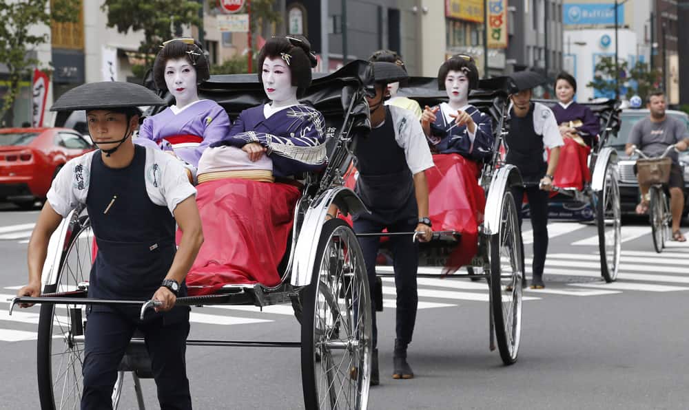 Geishas take a rickshaw ride in Asakusa, one of the most popular sightseeing spots, in Tokyo. Tokyo is competing with Madrid and Istanbul for the right to host the 2020 Olympic Games.